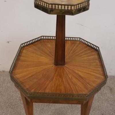 1158	OCTAGONAL TWO TIER STAND W/ BRASS GALLERY TOP SURFACE IS STONE 
