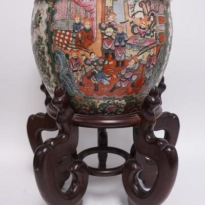 1126	HAND PAINTED ASIAN JARDINIERE DEPICTING PEOPLE, BIRDS, FLOWER & INTERIOR HAS KOI FISH ON A WOODEN STAND 
