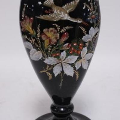 1110	BLACK GLASS VASE FINELY HAND PAINTED W/ FLOWERS & A BIRD IN FLIGHT HAS A SCULPTED CUT TOP RIM, THERE IS A SMALL FLAT FLAKE ON THE...