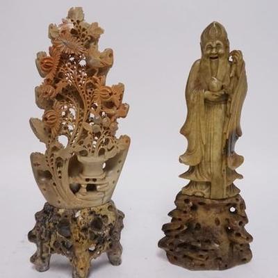 1118	TWO SOAPSTONE CARVINGS ONE OF A MAN AND ONE W/ AN INTRICATE FLORAL DESIGN, TALLEST IS 12 IN H 
