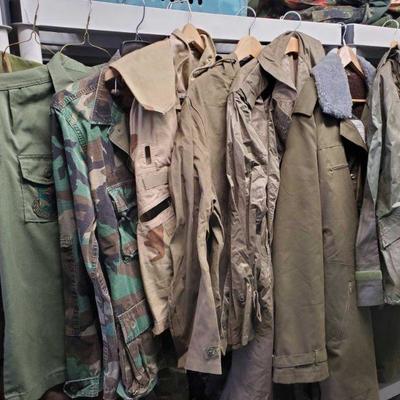7081: Military Jackets
9 green and camo jackets, shirts, and vest.