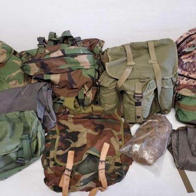 7121:  US Military Bags and Satchels
Green and camo packs, straps, buckles, and zippered closures.