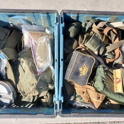 7130: 2 Totes of Military Packs, Pouches, Straps and More
Military green belts, pouches, bags. Food gear, sheaths, heater bag. Totes not...