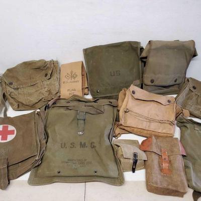 7122: Military Bags
Military green and tan varying bags. Water pack, medical bags, map pouch.