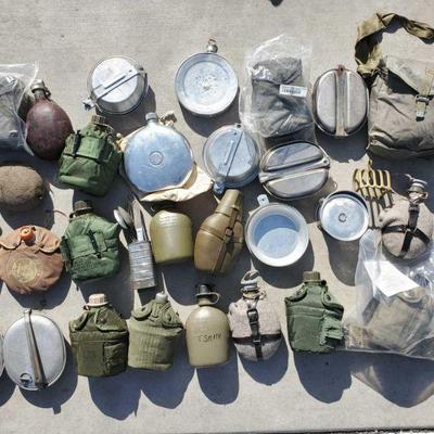 7080: Assorted Military Canteens and Dishware
Metal and plactic canteens with varying leather, nylon or plactic. pouches, coverings, or...