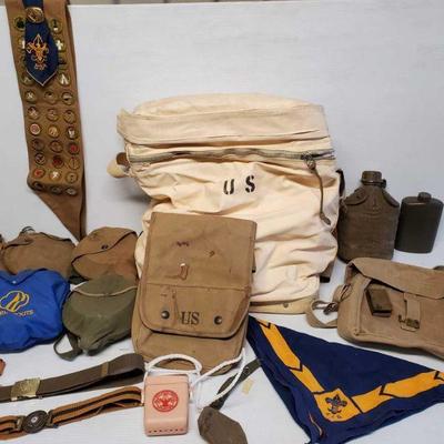 7104: Boy Scout Canteens and Gear
Boy scouts of America sash and handkerchief, canteens and pots, belts. Military bags.