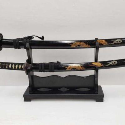 2403: 2 Samurai Swords With Display
2 Samurai Swords With Display, Display Measures Approx 14 in. Length, 11 in. Height. Swords Measures...