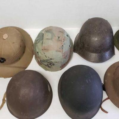 7051:9 Military Helmets With Two Helmet Covers.
9 Military Helmets With Two Helmet Covers.