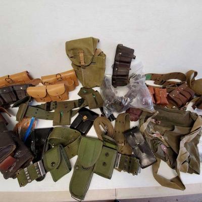 7093: Military Belts with Pouches
Belts with pouches, holsters, satchels, military oil tins, cam locks.
