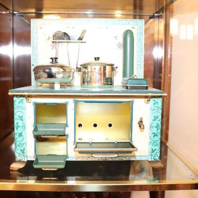 Child's toy stove in excellent condition with cookware. $45