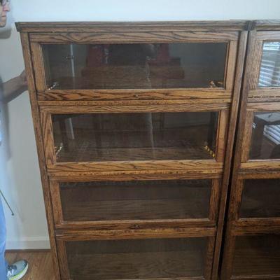 two lit barrister cabinets, four sections each. good condition with tube lighting in top two compartments, Dimensions (in inches) are...