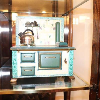 Child's toy stove in excellent condition with cookware. $45