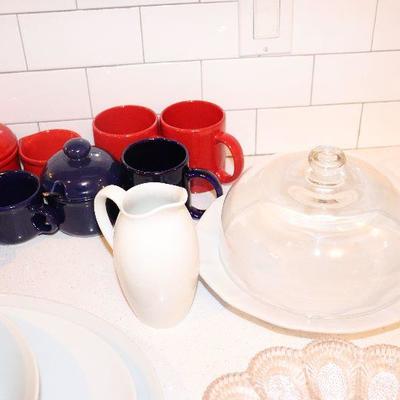 Cheese plate and cover $8, pitcher $5 red and blue sugars in back $4 each and mugs $1 each