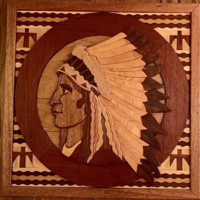 Hand crafted wood plaque of a Native American man
