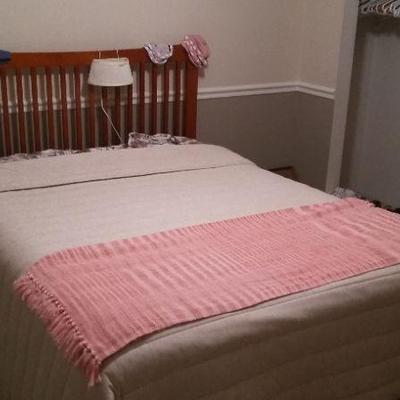 Queen size bed.  Includes mattress, box spring, bed frame and linens.