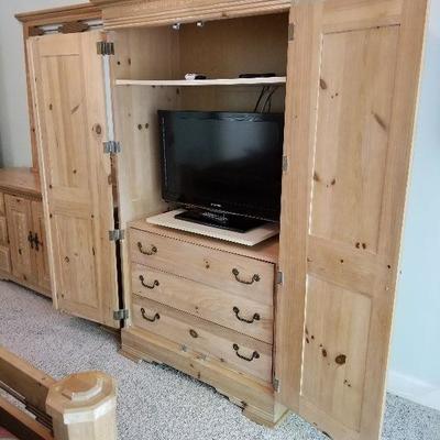 Lot # 70 - $110 Wood Armoire 45" long X 74.5" tall X 23" wide (Front view of Cabinet LOT # 70) TV is NOT included but is...
