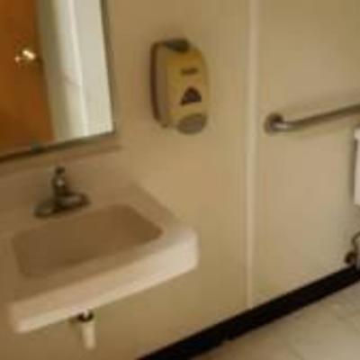 ladies bathroom sink toilet paper towel mirror soap