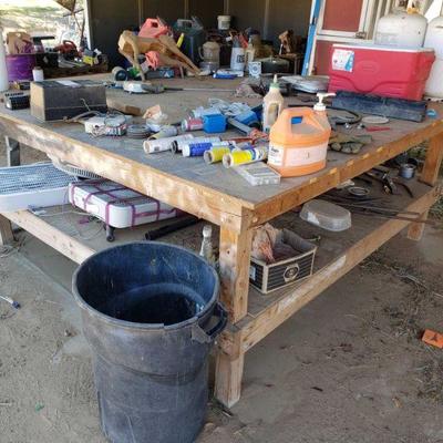 3528: Wooden Work Bench with Everything on it
Includes 2 propane tanks, box fans, gas cans, 2 batteries, and other misc items. Work bench...
