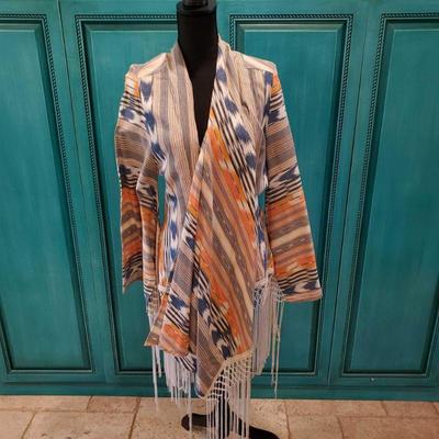 Sky Poncho in size Medium
Size Medium