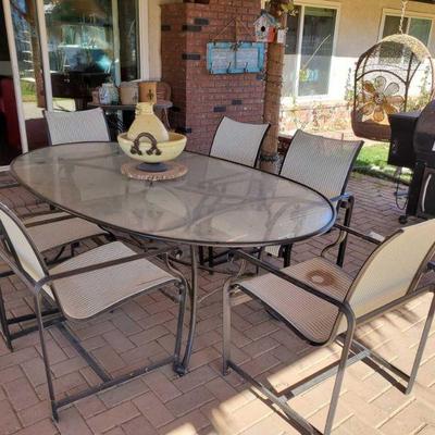10005: Glass Top Patio Table with 6 Chairs
Tables measures approx 85