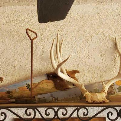 5007: Metal Shelf with Antlers, Decorative Saws, Metal Book and More
Shelf measures approx 42"x14"x10"