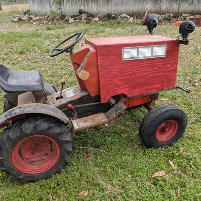 Homemade garden tractor. It runs and drives good. We have used it to haul trash to the dumpster. 