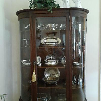 Beauatiful Antique Oak Bow Front Cabinet filled with Silver and Silverplate