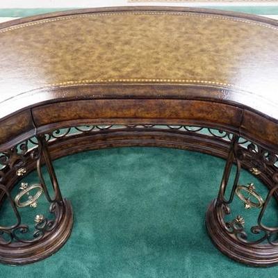1022	LEATHER TOP KIDNEY SHAPED DESK WITH A FANCY IRON AND BRASS BASE. ONE DRAWER
