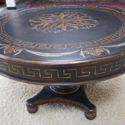 1029	STENCIL DECORATED ROUND PEDESTAL TABLE. EBONIZED FAUX LEATHER FINISH
