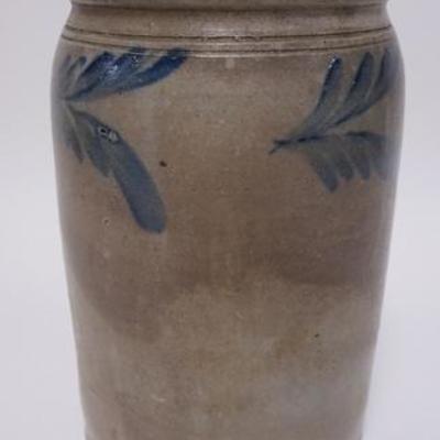 1010	BLUE DECORATED STONEWARE JAR. 10 1/2 IN H 2 BASE CHIPS
