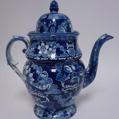 1018	.EARLY BLUE TRANSFERWARE COFFEE POT. HAS A LARGE CHIP ON THE FITTER RIM OF THE LID AND A SMALL CHIP ON THE SPOUT. 12 IN H
