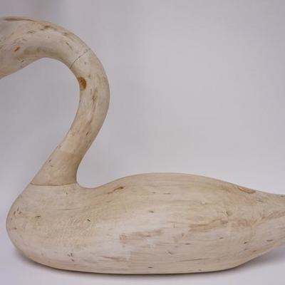1016	RICHARD CONNALY LARGE CARVED WOODEN SWAN *WHISTLING SWAN 1984*. GLASS EYES. 30 IN LONG 20 1/4 IN H
