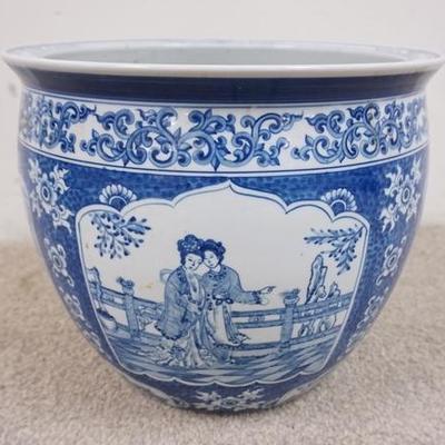 1053	BLUE AND WHITE ASIAN JARDINIERE WITH 4 DIFFERENT SCENES. 12 1/2 IN H, 14 3/4 IN TOP DIAMETER
