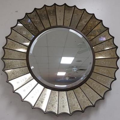 1033	SUNBURST BEVELED MIRROR WITH DECORATED MIRROR FRAME AND SCALLOPED RIM. 32 IN DIAMETER
