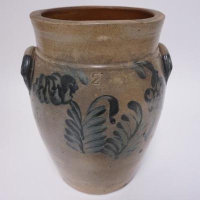 1003	BLUE DECORATED STONEWARE CROCK WITH HANDLES.2 GAL 12 1/2 IN H

