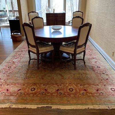 This photo is of the rug/carpet.  Dining Table and Chairs have sold