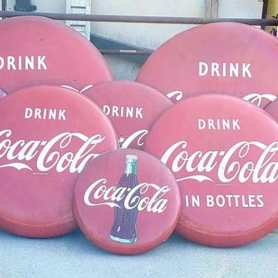 8 Coke buttons to be sold 