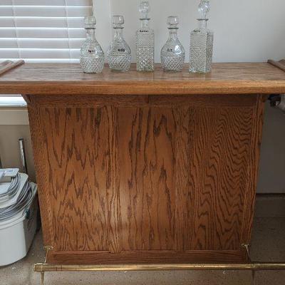 Oak Bar with brass foot rest. This would be good for the man cave 
