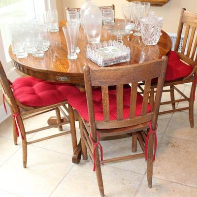 Round Oak tabletop with four chairs