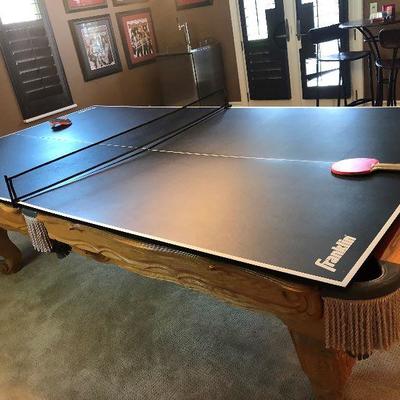 Pool table with added ping pong table on top
