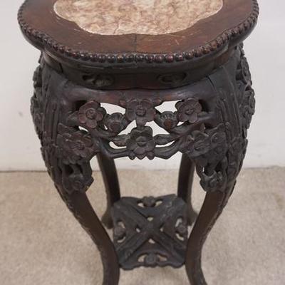 1050	CARVED ASIAN STAND W/ AN INSET MARBLE TOP 
