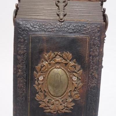 1044	VICTORIAN PHOTO ALBUM IN AN ORNATE BRASS/BRONZE FRAME, COVER IS DETACHED, 17 1/2 IN H, 8 3/4 IN W
