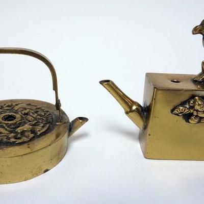 1009	2 ASIAN BRASS INK POTS WITH RELIEF DECORATIONS. TALLEST 3 3/4 IN
