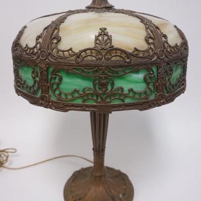 1048	SIGNED SLAG GLASS TABLE LAMP, HAS CARAMEL SLAG TOP & GREEN BORDER & AN ORNATE METAL OVERLAY, 23 IN H 
