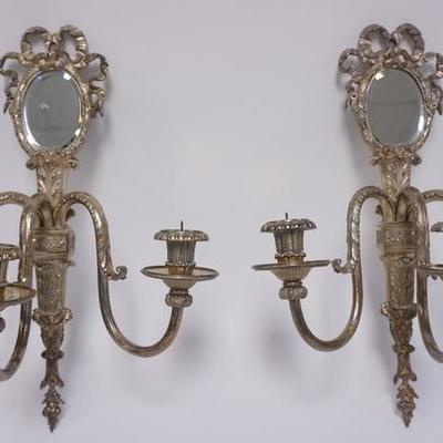 1004	PAIR OF SILVER PLATED 3 LIGHT PRICKET SCONCES WITH OVAL BEVELED MIRRORS. 19 IN H, 15 IN WIDE
