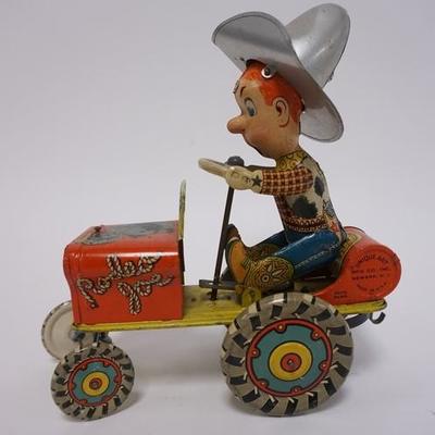 1017	RODEO JOE TIN WIND UP TOY BY UNIQUE ART NEWARK NJ 6 3/4 IN LONG, 9 IN H
