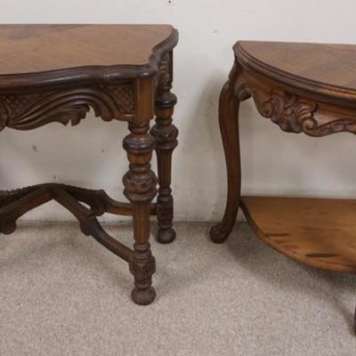 1053	TWO CARVED DEMILUNE STANDS 
