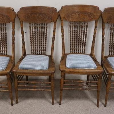 1067	SET OF FOUR OAK PRESS BACK CHAIRS WITH TWIST SPINDLES 
