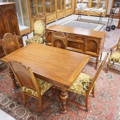 1010	CARVED WALNUT 9 PC DINING ROOM. TABLE WITH TWO 15 IN PULLOUT LEAVES, 6 CHAIRS, BUFFET AND BLIND CHINA CABINET
