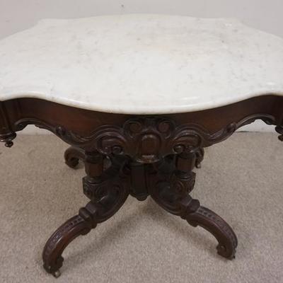 1054	CARVED VICTORIAN MARBLE TOP TURTLE TOP TABLE 

